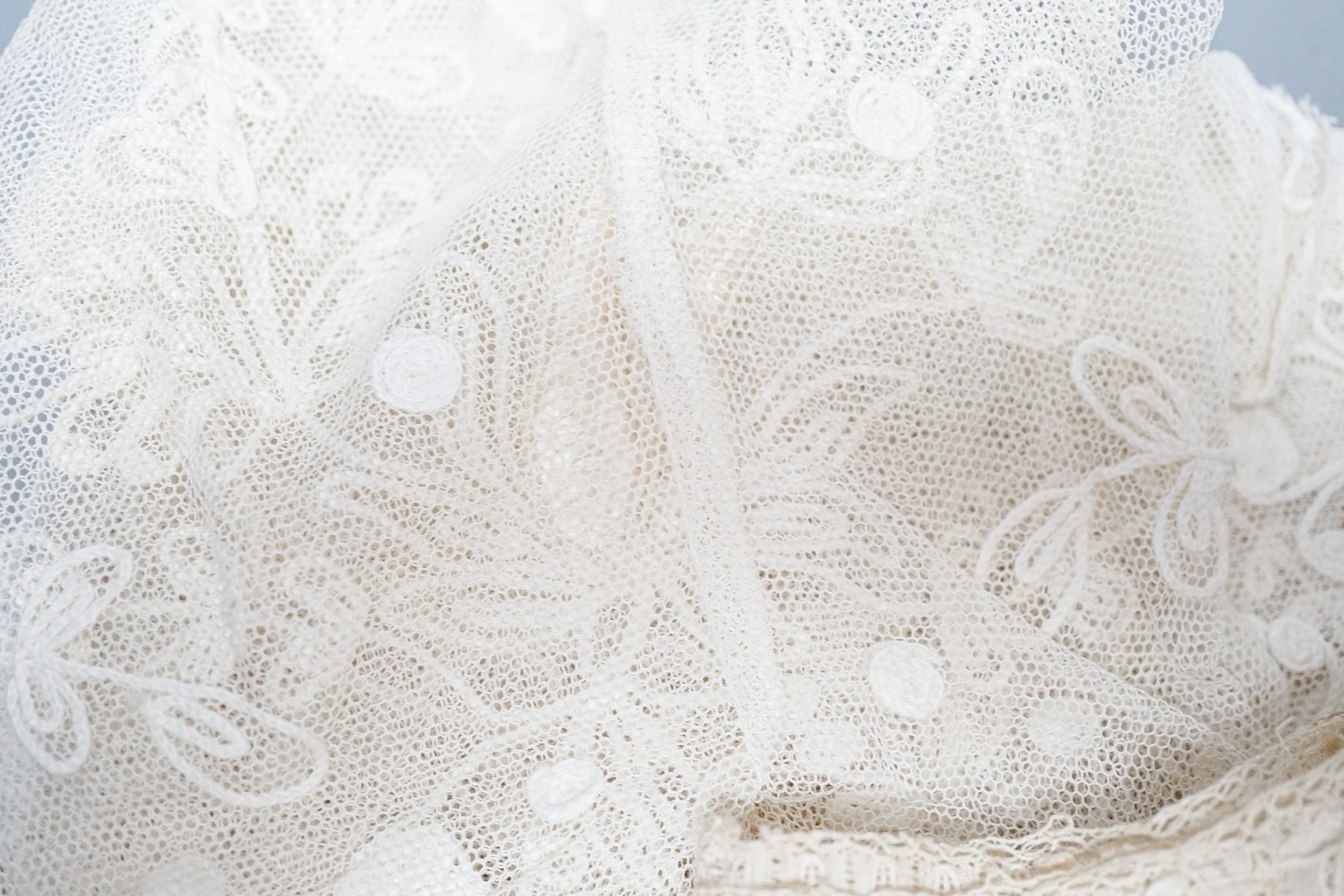 A large tape lace 'Bertha', various hand made laces, lengths of needle run laces, a skirt panel etc.